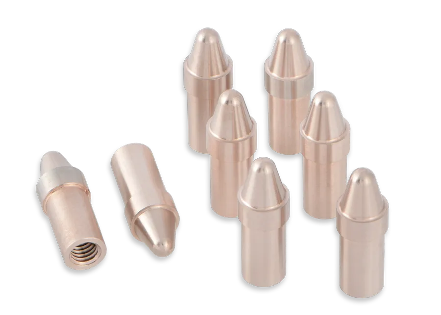 Eight copper welding tips are arranged on a black background, with one tip lying down to show its threaded end. The tips are cylindrical with rounded, pointed tops.