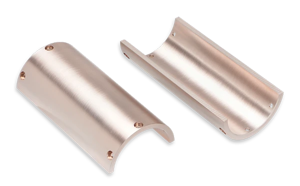 Two semi-cylindrical, metallic components with a smooth finish, each featuring three screw holes along the edges, placed on a black background.